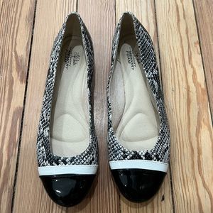 Black snakeskin flats